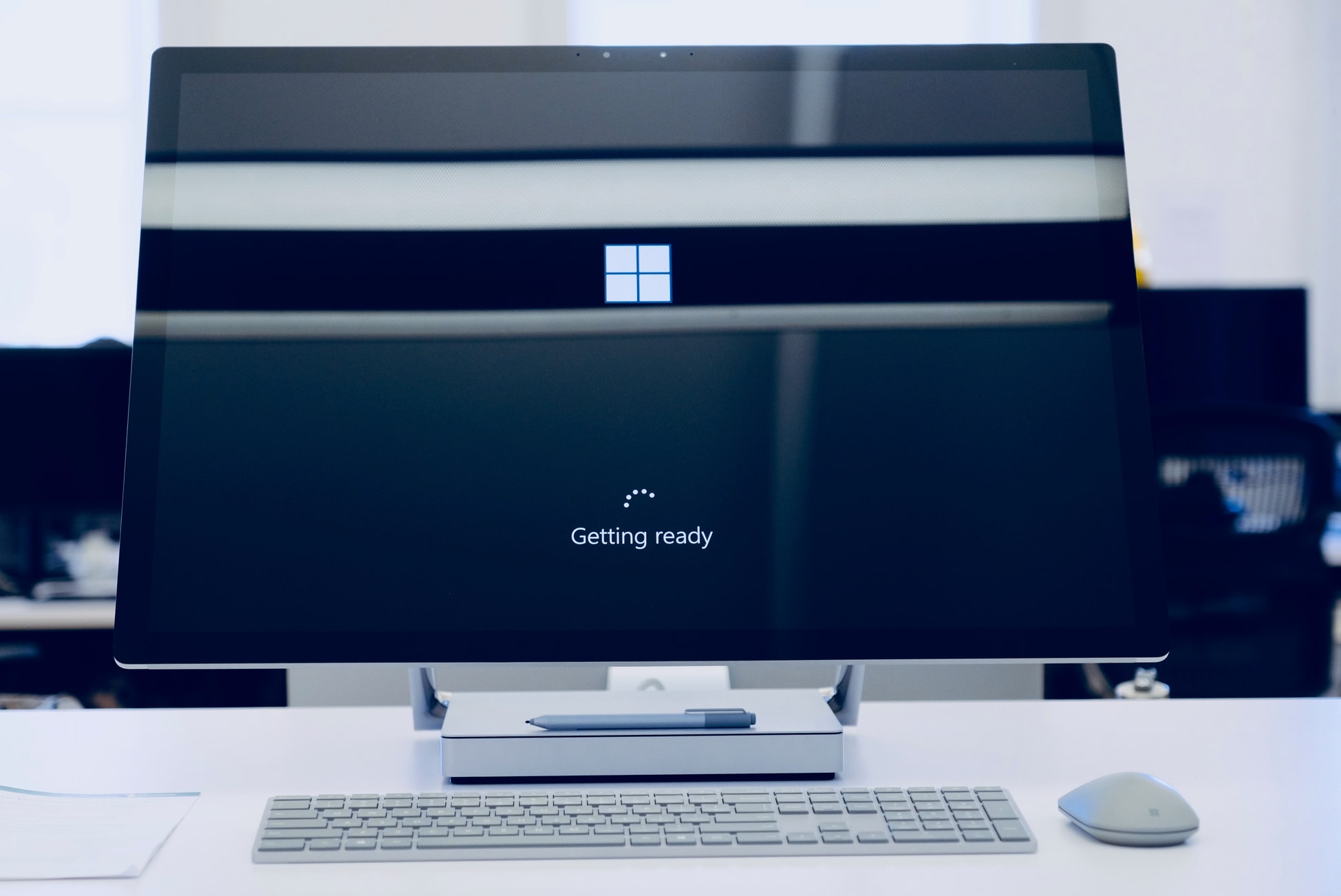 A microsoft computer booting up with MS logo on the home screen