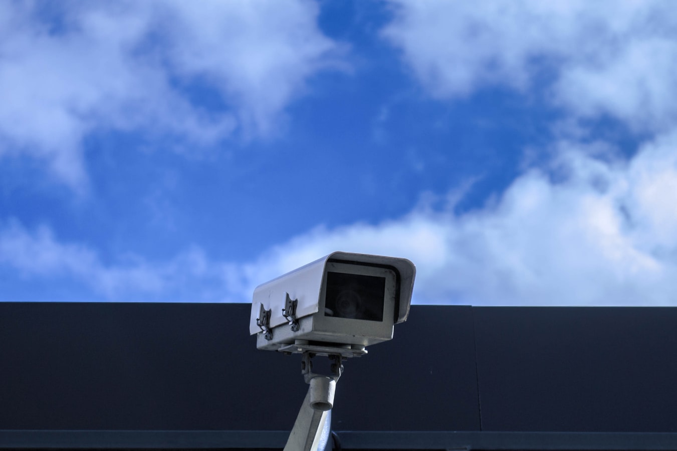 A security camera looking out on the side of a building