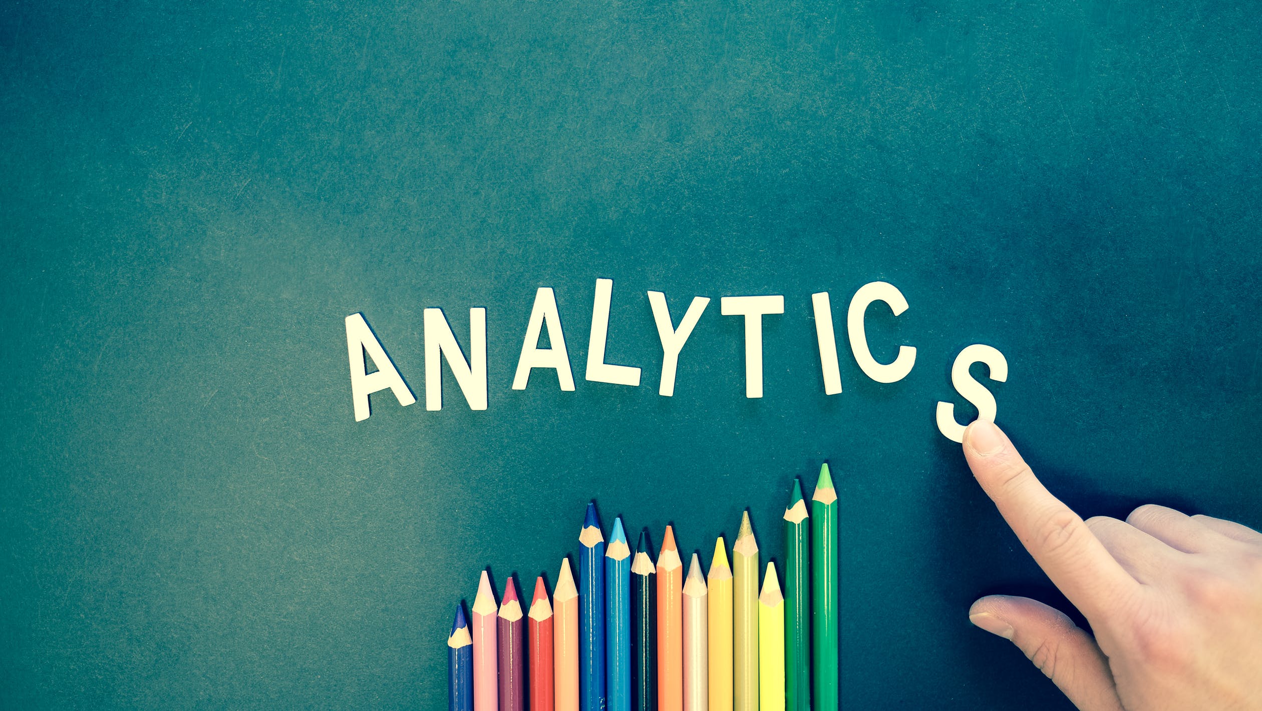 the word Analytics spelled out with wood letters