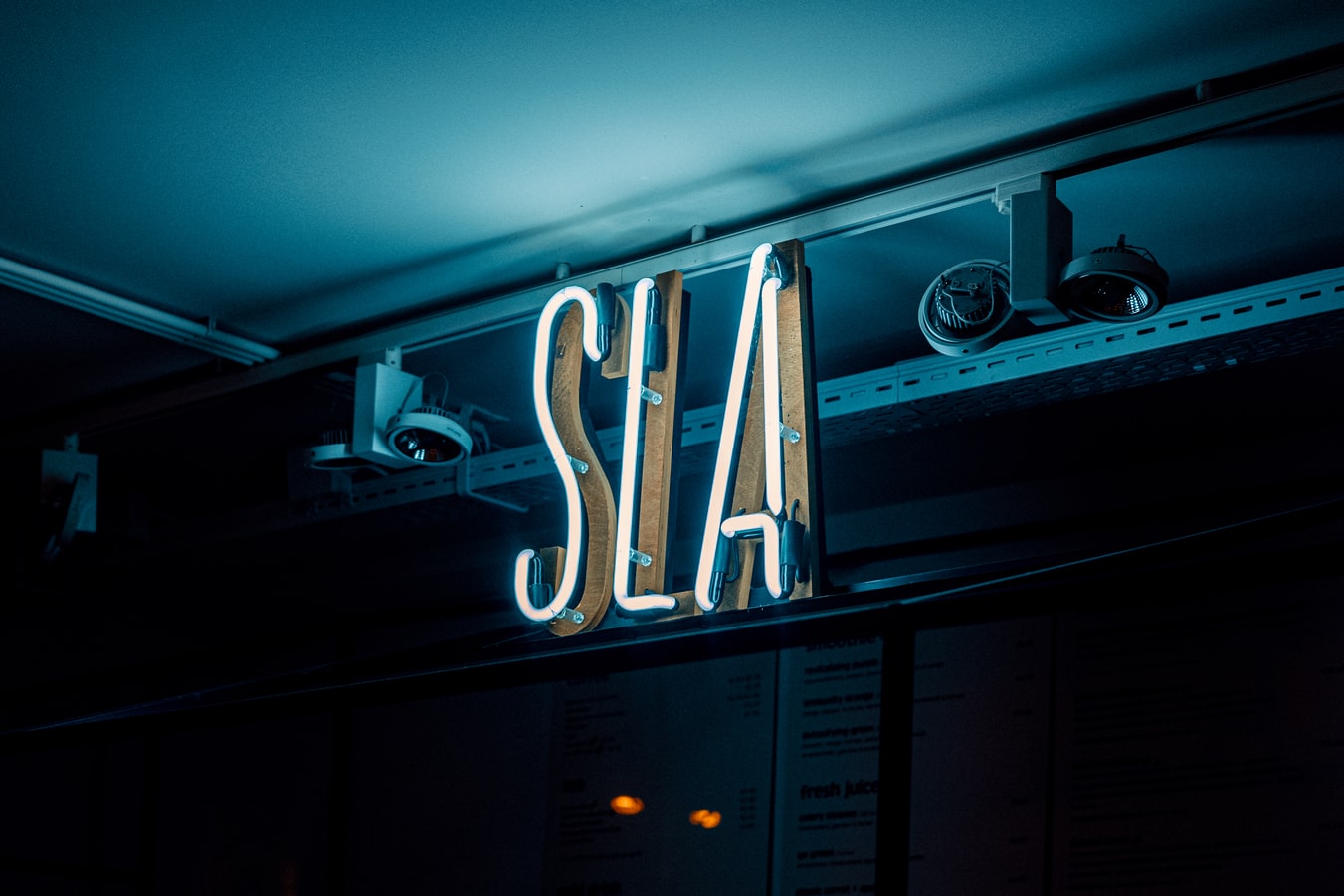 A neon sign with the letters 'SLA'